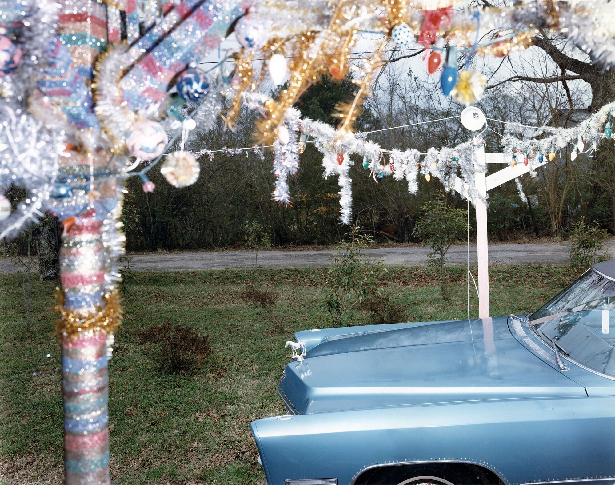 Vincent Borrelli: "'67 Caddy and Porch of 'The Rhinestone Cowboy' (Loy Allen Bowlin), Mississippi, 1989" (20x24" Type-C Print), Limited Edition (from the Series "Folk Art Environments")